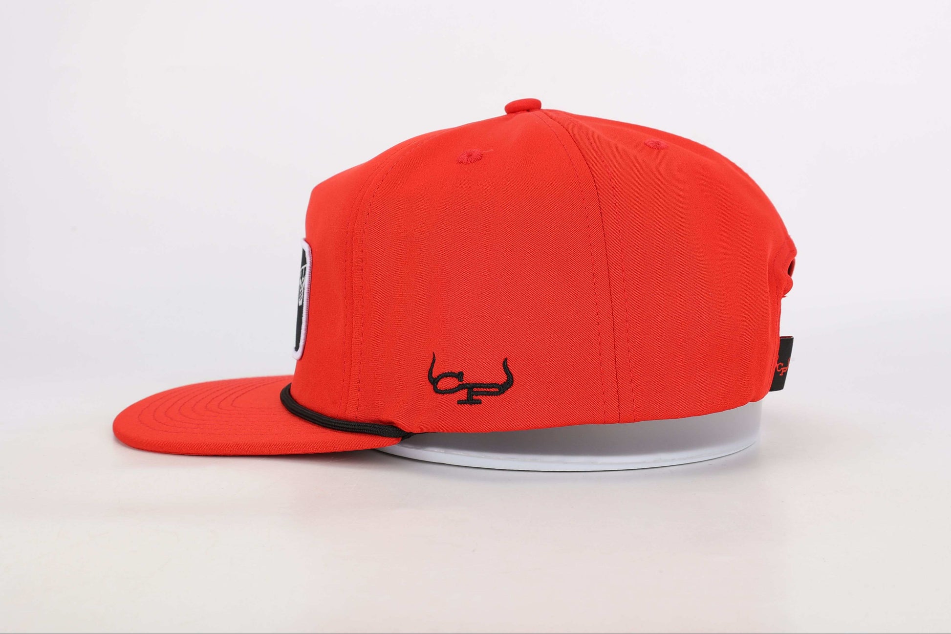 Red snapback cap with a woven patch that reads 'Real Cowboy Shit'. Right Side View