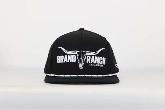 Black cap with a embroidered logo of a longhorn with texts that says 'BRAND RANCH' in white bold 3d embroidery. Front View