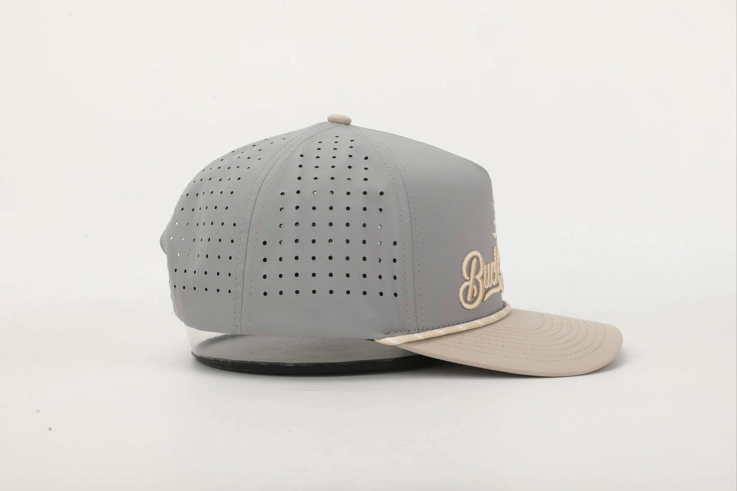 Gray and Beige cap with 'Buck the System' logo in Old Gold embroidery, Left Side View.