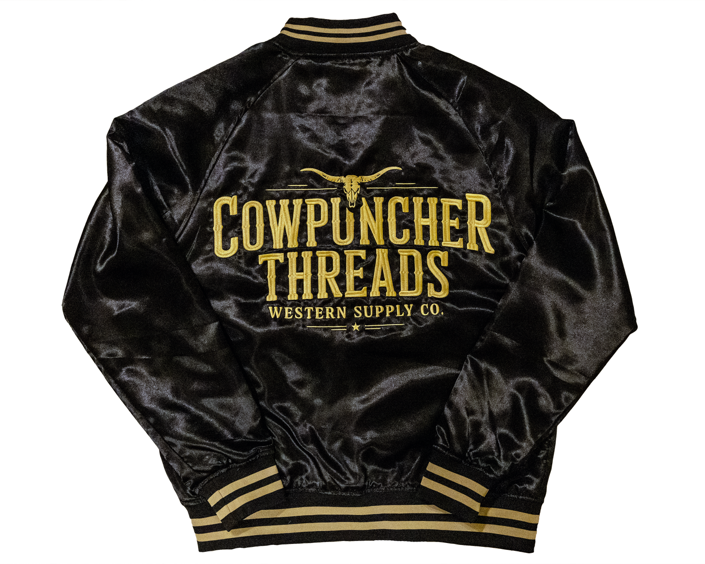 Black satin rodeo bomber jacket with 'Cowpuncher Threads' logo in gold embroidery on a transparent background.