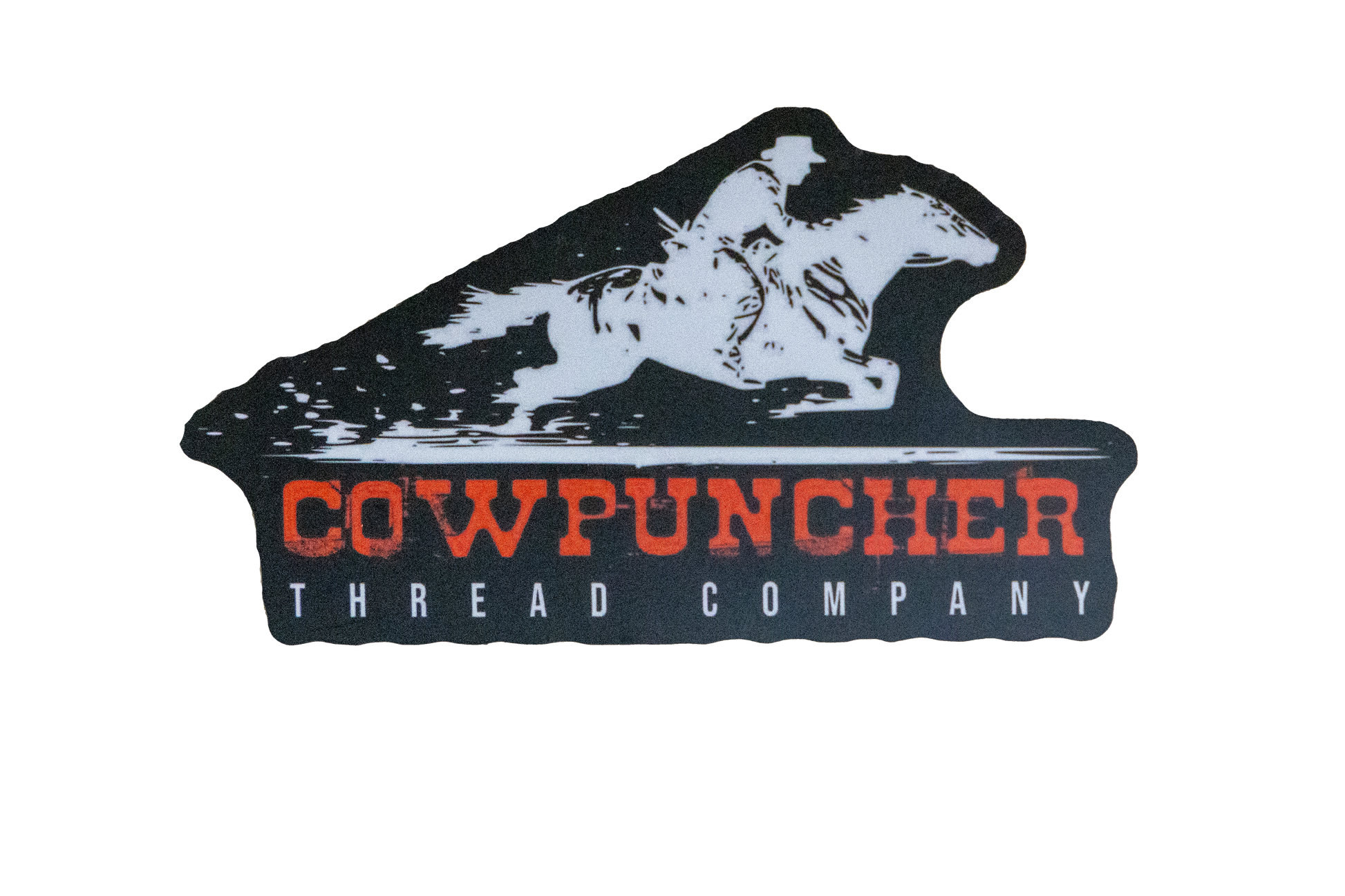 Sticker of a white horse and rider design above the text 'Cowpuncher Thread Company' in red, on black background.