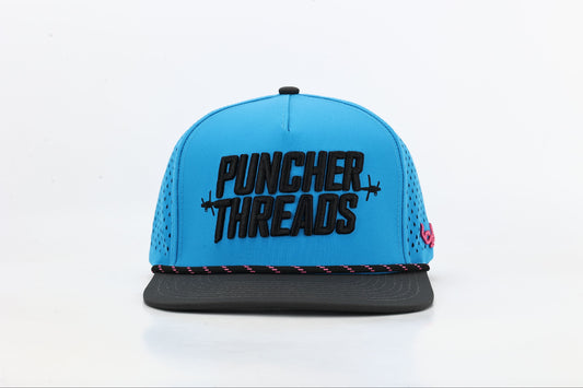 Blue and black cap with 'PUNCHER THREADS' In bold black embroidery with barbed wire accents, black and pink rope. Front View