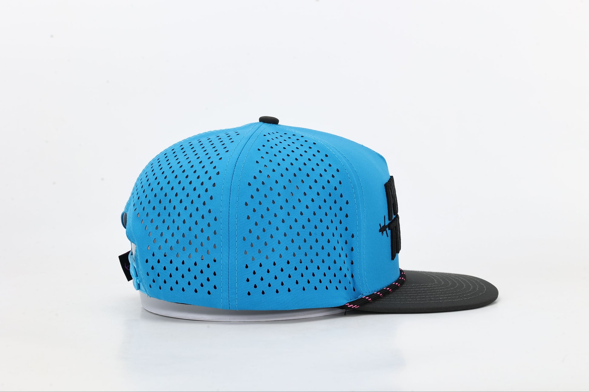 Blue and black cap with 'PUNCHER THREADS' In bold black embroidery with barbed wire accents, black and pink rope. Left Side View