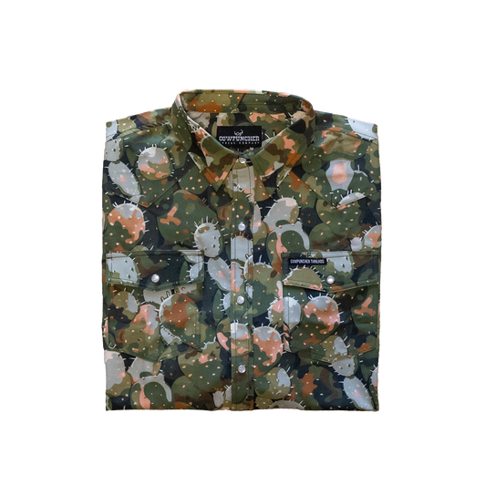 Folded cactus camouflage-patterned shirt on a transparent background