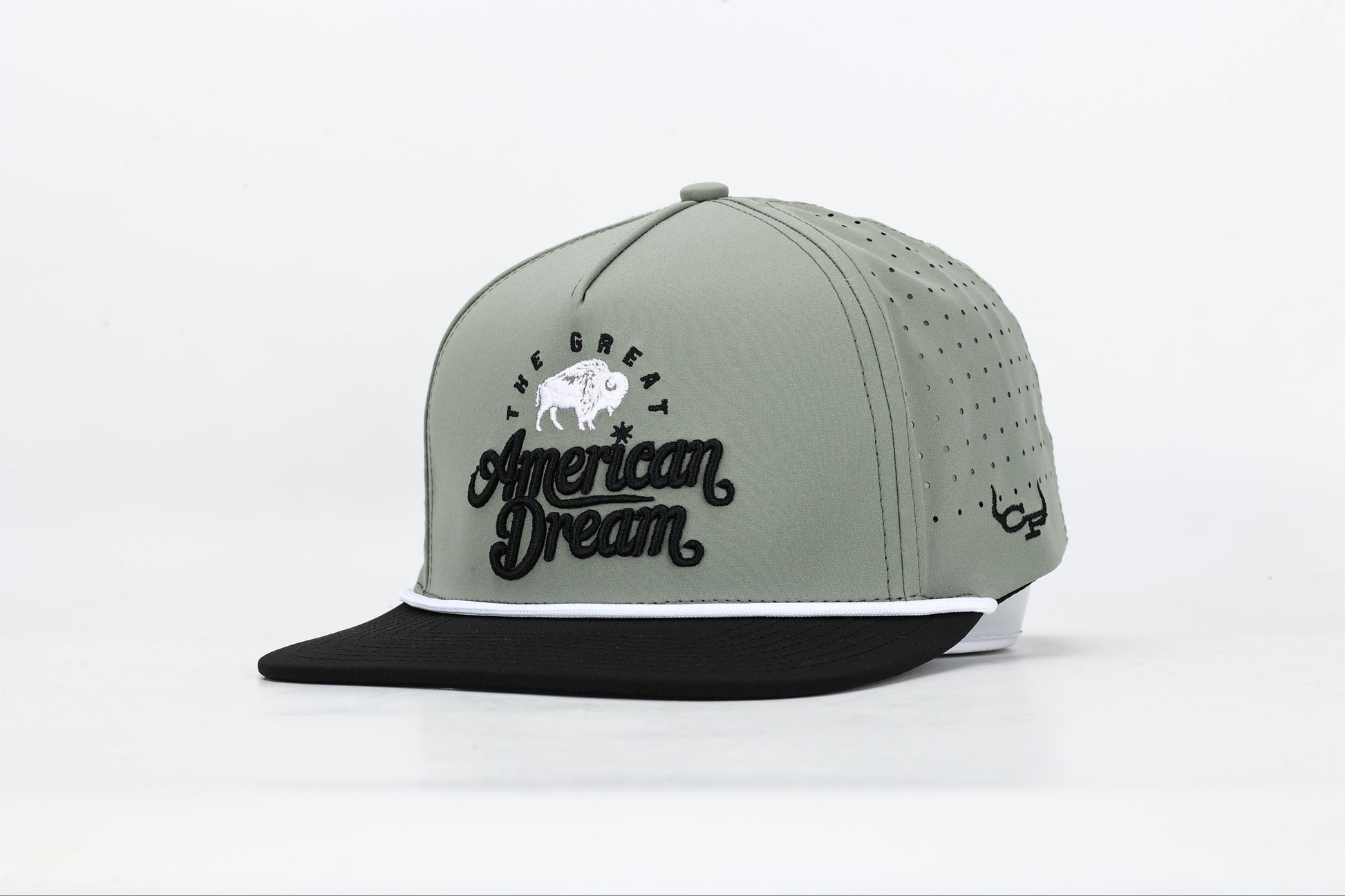 Olive green and black snapback cap with "The Great American Dream" embroidered on the front in black and white, featuring a white buffalo design. Angled View